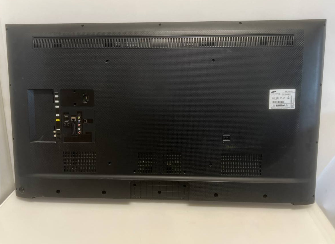 Back view of a black electronic device on a white background